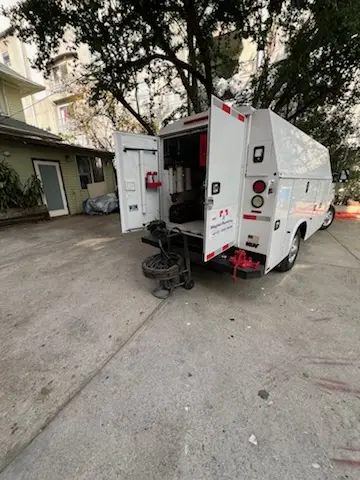 Magnet Plumbing service vehicle on-site for Grease Trap Cleaning in Florida Center North
